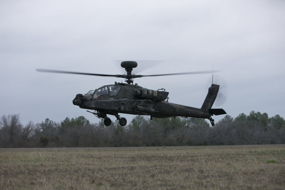 An AH-64 Apache helicopter in midair Conroe Texas Canvas Art - Terry MooreStocktrek Images (35 x 23)