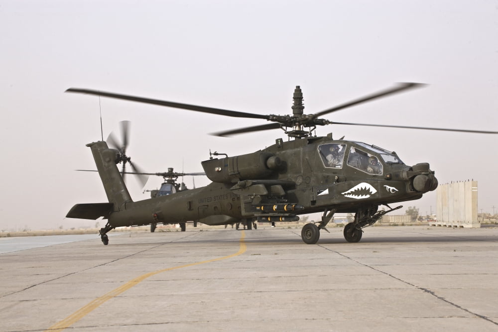 An AH-64 Apache helicopter taxiing on the flight line Canvas Art - Terry MooreStocktrek Images (18 x 12)