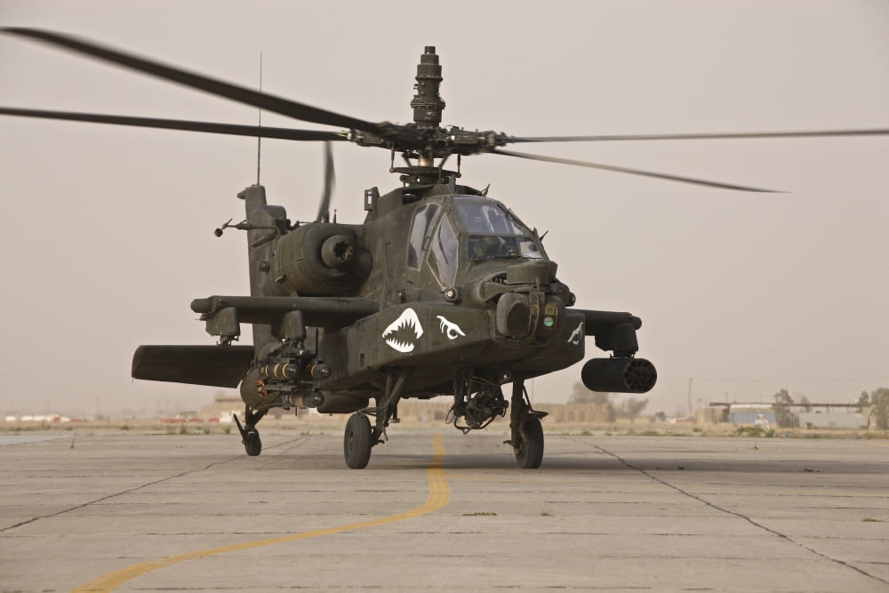 An AH-64 Apache helicopter taxiing on the flight line Canvas Art - Terry MooreStocktrek Images (35 x 23)