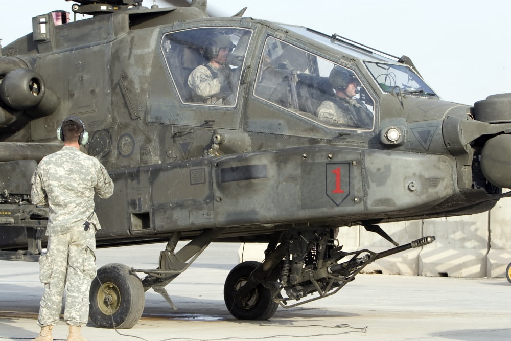 An AH-64 Apache prepares to leave its pad for a mission Canvas Art - Terry MooreStocktrek Images (35 x 23)