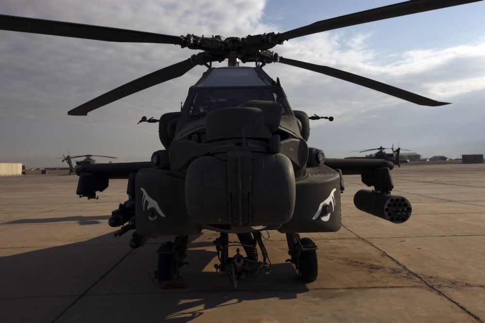 An AH-64D Apache Longbow Block III on the flight line at Camp Speicher Canvas Art - Terry MooreStocktrek Images (18 x 12)
