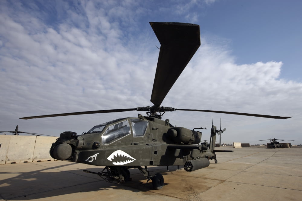 An AH-64D Apache Longbow Block III on the flight line at Camp Speicher Canvas Art - Terry MooreStocktrek Images (18 x 12)