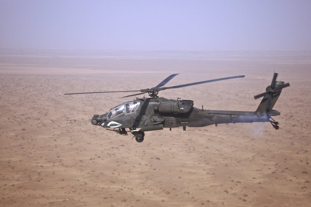 An AH-64D Apache Longbow fires a hydra rocket over Iraq Canvas Art - Terry MooreStocktrek Images (18 x 12)