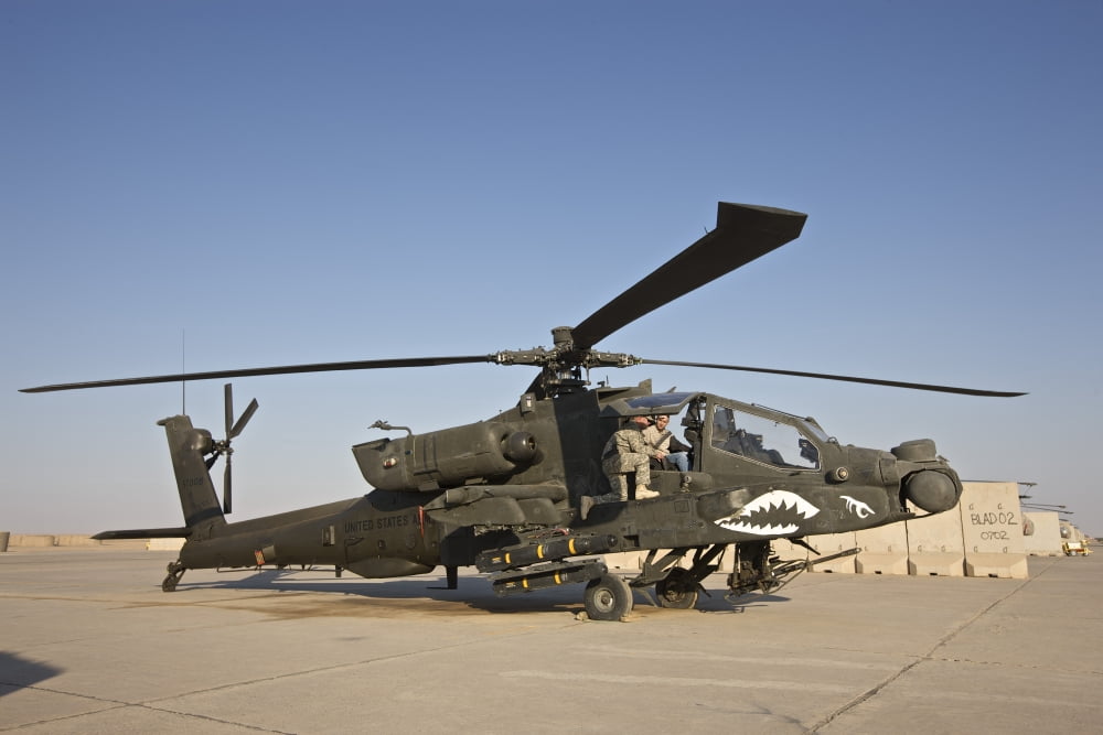 An AH-64D Apache Longbow parked at a military base in Iraq Canvas Art - Terry MooreStocktrek Images (35 x 23)