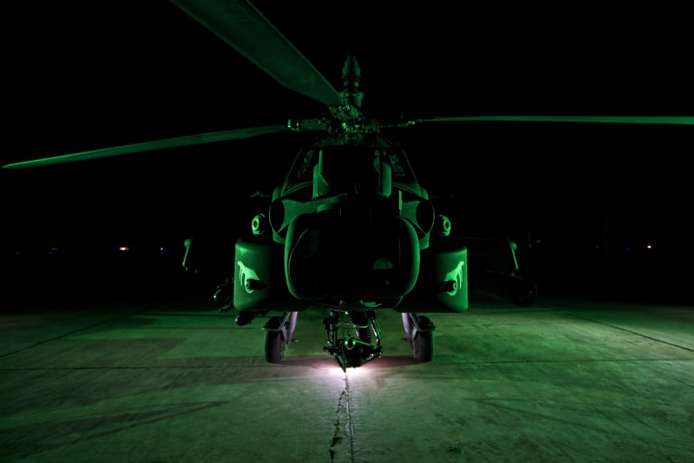An AH-64D Apache helicopter at night Canvas Art - Terry MooreStocktrek Images (35 x 23)