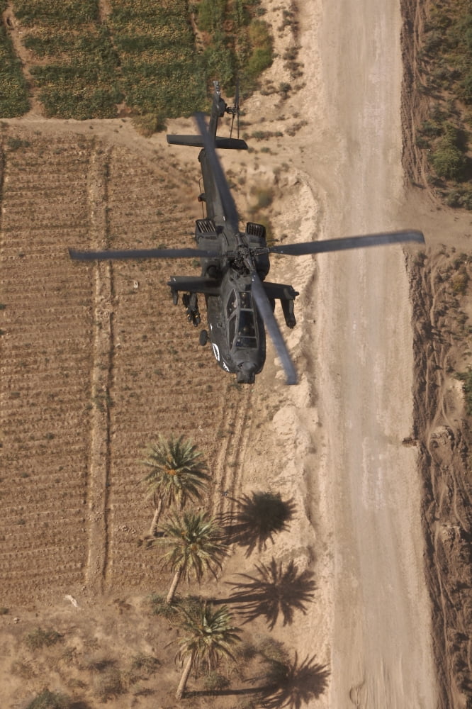 An AH-64D Apache helicopter in flight over Northern Iraq Canvas Art - Terry MooreStocktrek Images (12 x 18)