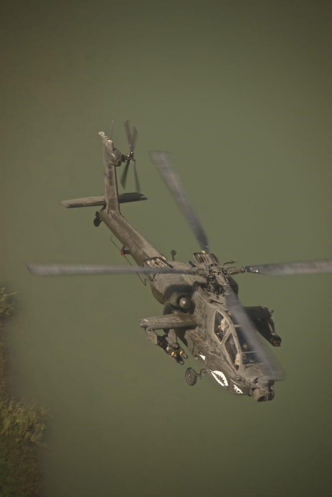 An AH-64D Apache helicopter in flight over Northern Iraq Canvas Art - Terry MooreStocktrek Images (12 x 18)