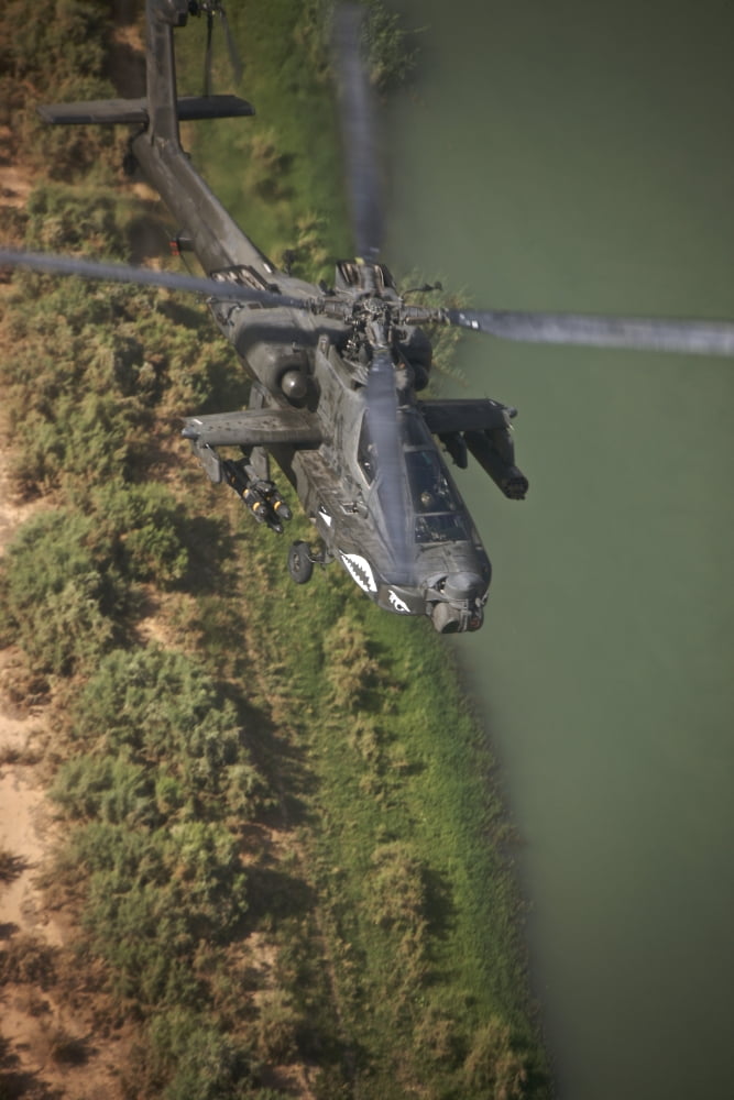 An AH-64D Apache helicopter in flight over Northern Iraq Canvas Art - Terry MooreStocktrek Images (12 x 18)
