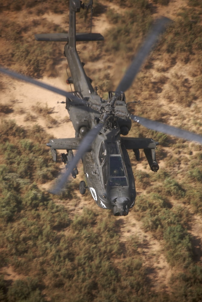 An AH-64D Apache helicopter in flight over Northern Iraq Canvas Art - Terry MooreStocktrek Images (23 x 35)