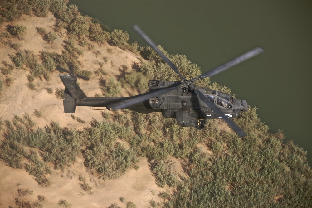 An AH-64D Apache helicopter in flight over Northern Iraq Canvas Art - Terry MooreStocktrek Images (35 x 23)