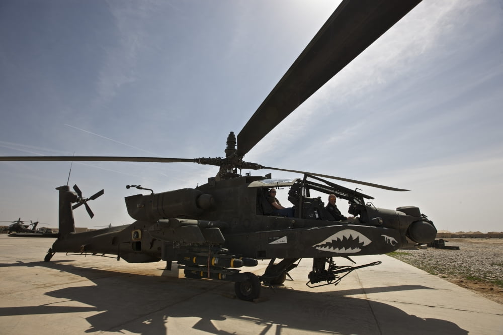 An AH-64D Apache helicopter parked at Camp Speicher Iraq Canvas Art - Terry MooreStocktrek Images (18 x 12)