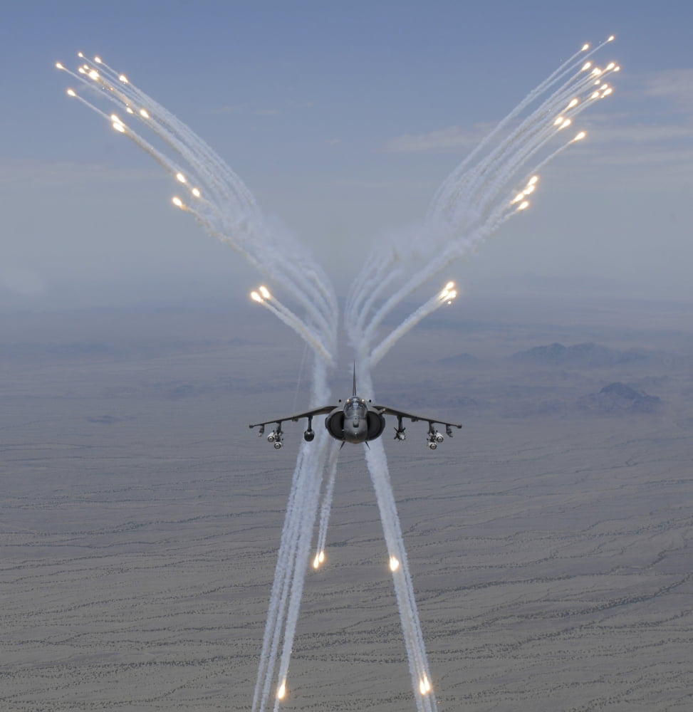 An AV-8B Harrier fires flares during a training flight Canvas Art - Stocktrek Images (28 x 29)