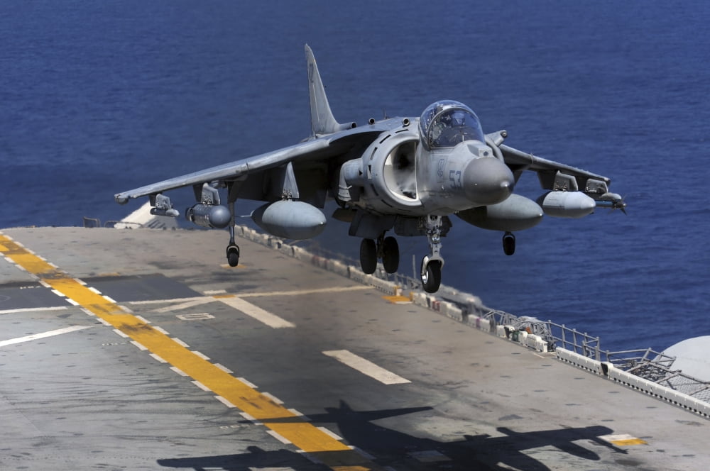 An AV-8B Harrier jet lands on the flight deck of USS Essex Canvas Art - Stocktrek Images (35 x 23)