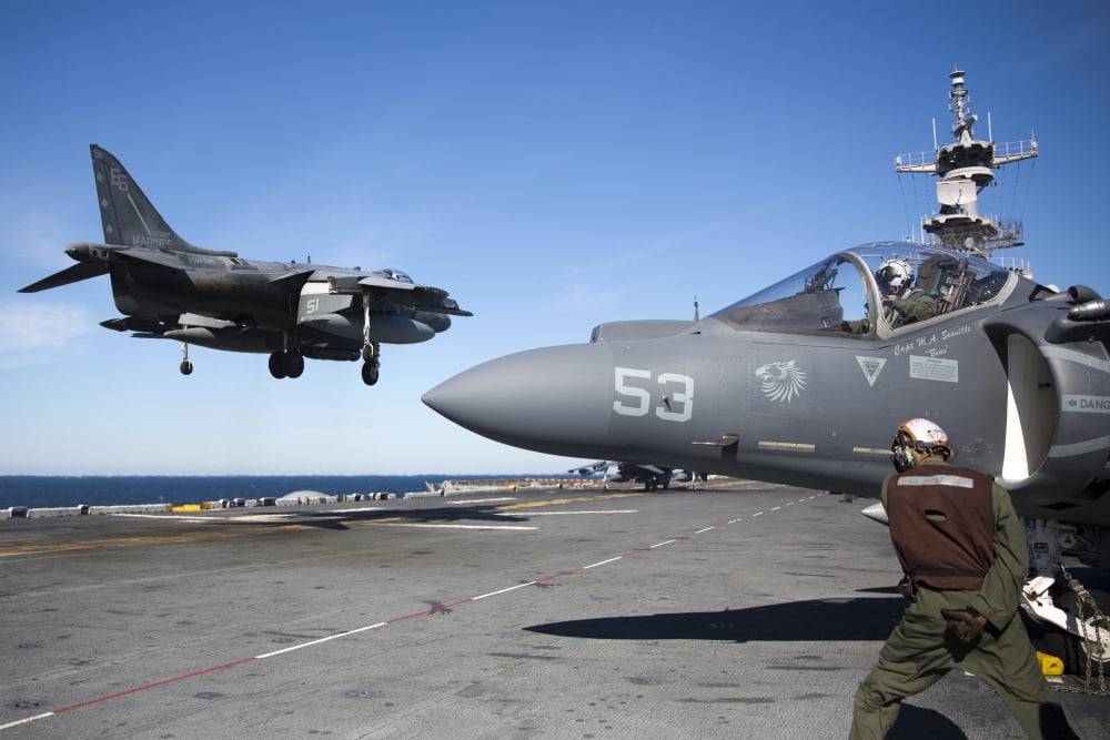 An AV-8B Harrier lands on the flight deck of USS Kearsarge Canvas Art - Stocktrek Images (35 x 23)
