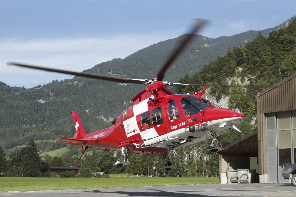 An AW109 helicopter of the Swiss Air Rescue (REGA) taking off Canvas Art - Luca NicolottiStocktrek Images (34 x 23)