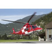 An AW109 helicopter of the Swiss Air Rescue REGA taking off Canvas Art - Luca NicolottiStocktrek Images 34 x 23