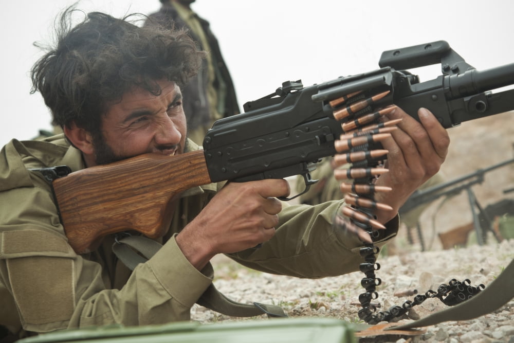 An Afghan Local Police officer fires a machine gun during live-fire training Canvas Art - Stocktrek Images (35 x 23)