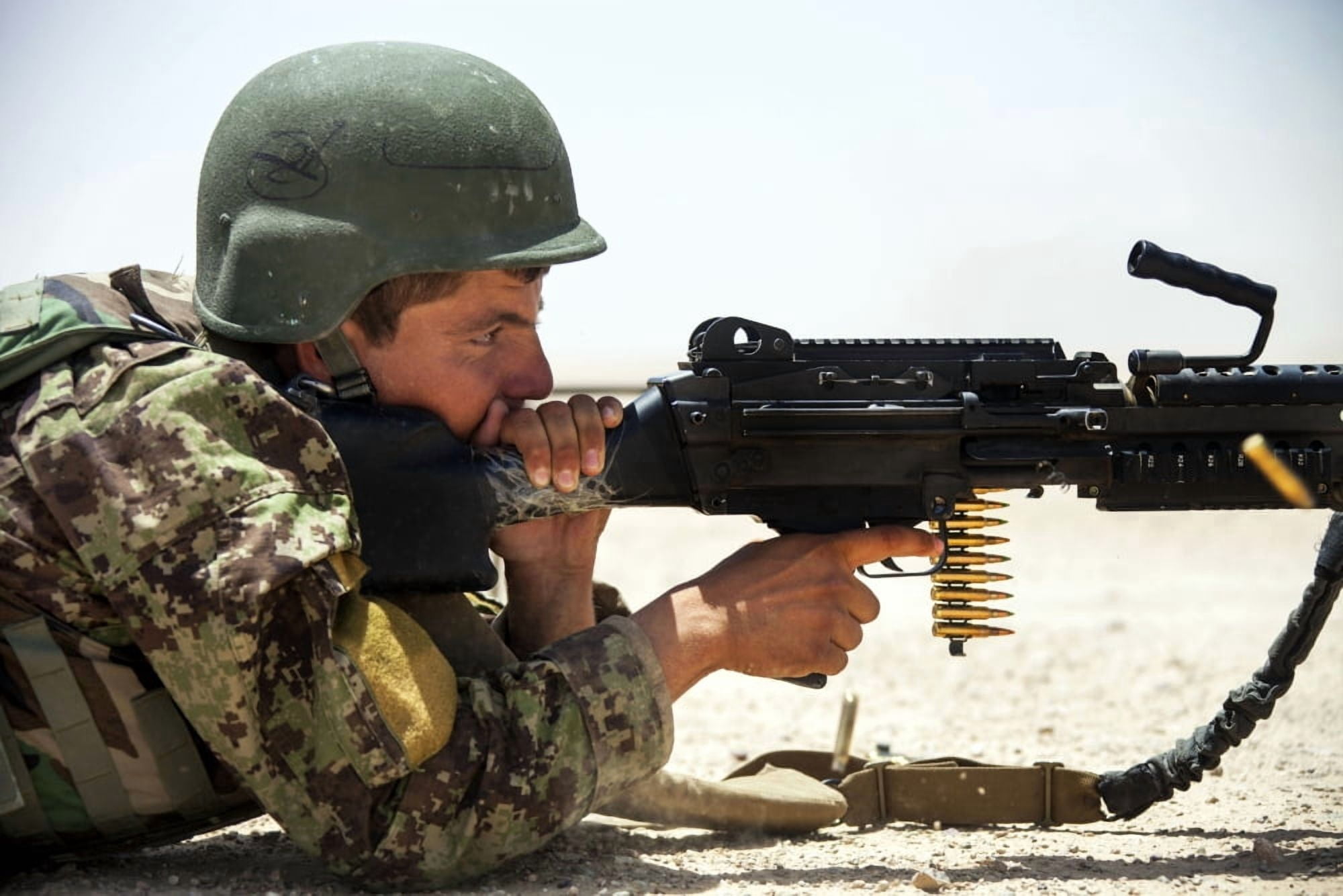 An Afghan National Army soldier fires an M240B machine gun Canvas Art - Stocktrek Images (35 x 23)