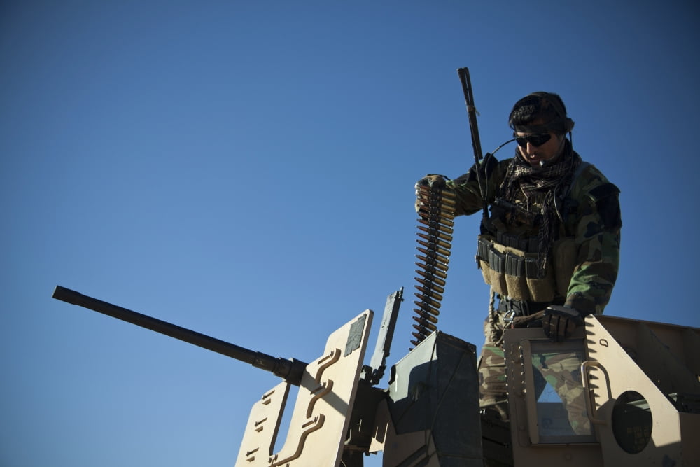 An Afghan National Army soldier prepares a 50-caliber machine gun Canvas Art - Stocktrek Images (35 x 23)