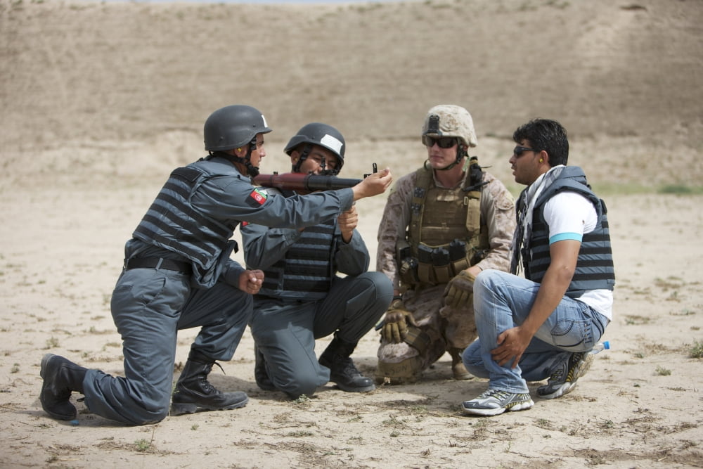 An Afghan Police student loads a RPG-7 grenade launcher Canvas Art - Terry MooreStocktrek Images (18 x 12)
