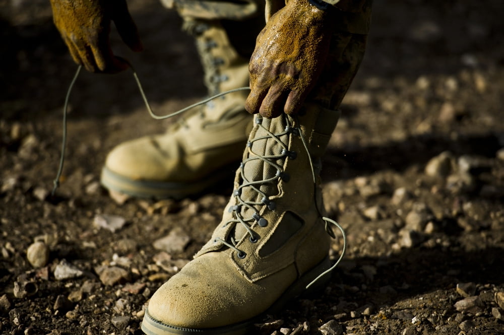 An Air Force Basic Military Training trainee reties his boots Canvas Art - Stocktrek Images (35 x 23)