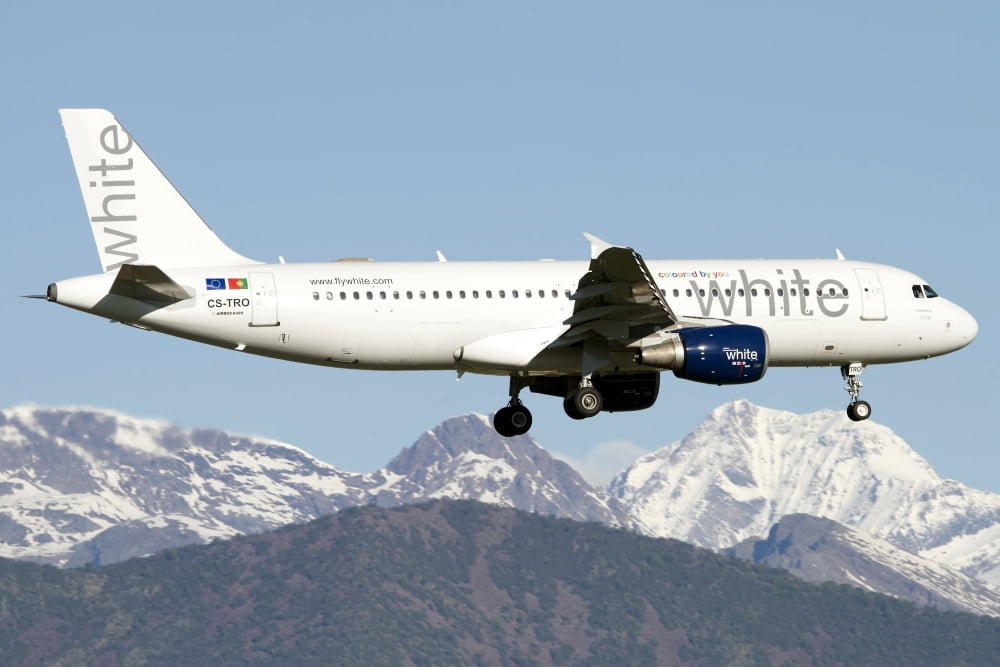 An Airbus A320 of White Airways flying over Italy Canvas Art - Luca NicolottiStocktrek Images (18 x 12)
