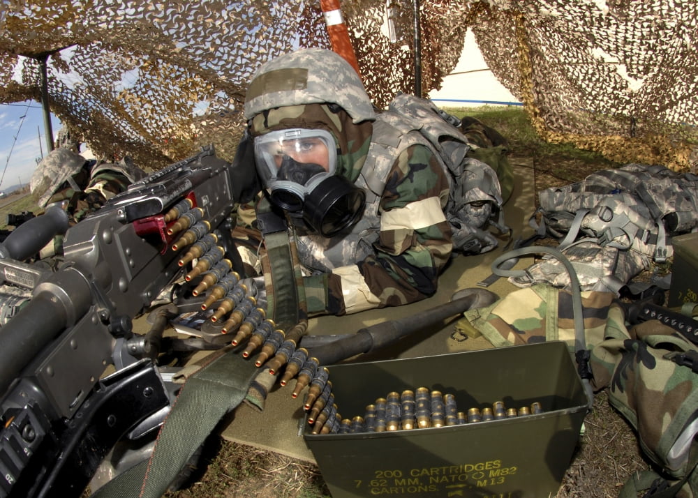 An Airman defends her position firing a M-240B machine gun Canvas Art - Stocktrek Images (34 x 24)