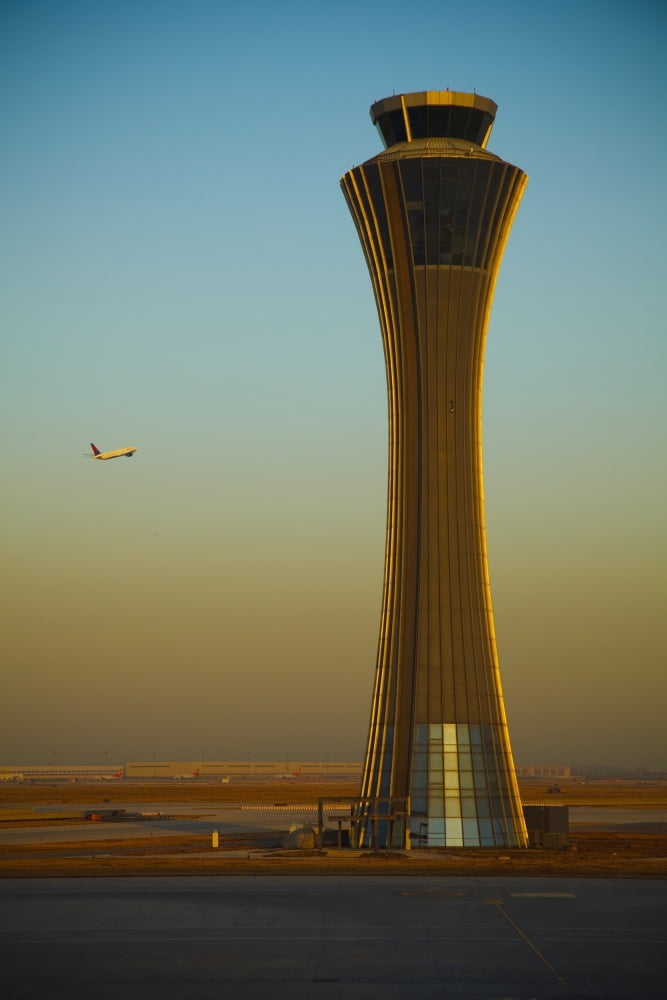 An Airplane Flies Past The Air Traffic Control Tower At The Beijing Airport Beijing China Canvas Art - Blake Kent Design Pics (24 x 38)