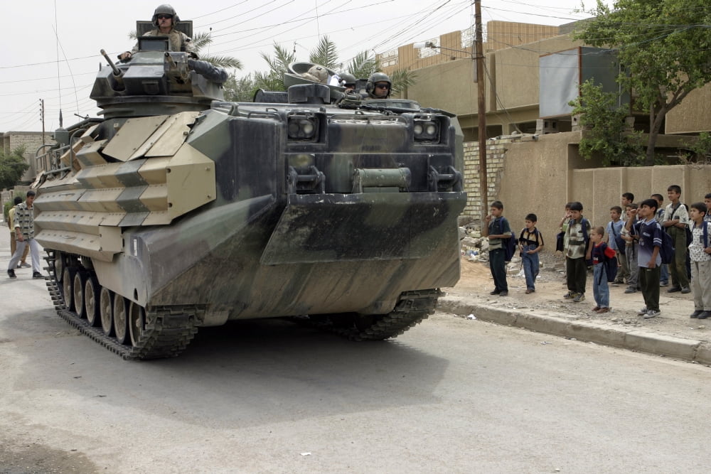 An Amphibious Assault Vehicle rolls down the city streets while patrolling Canvas Art - Stocktrek Images (34 x 23)