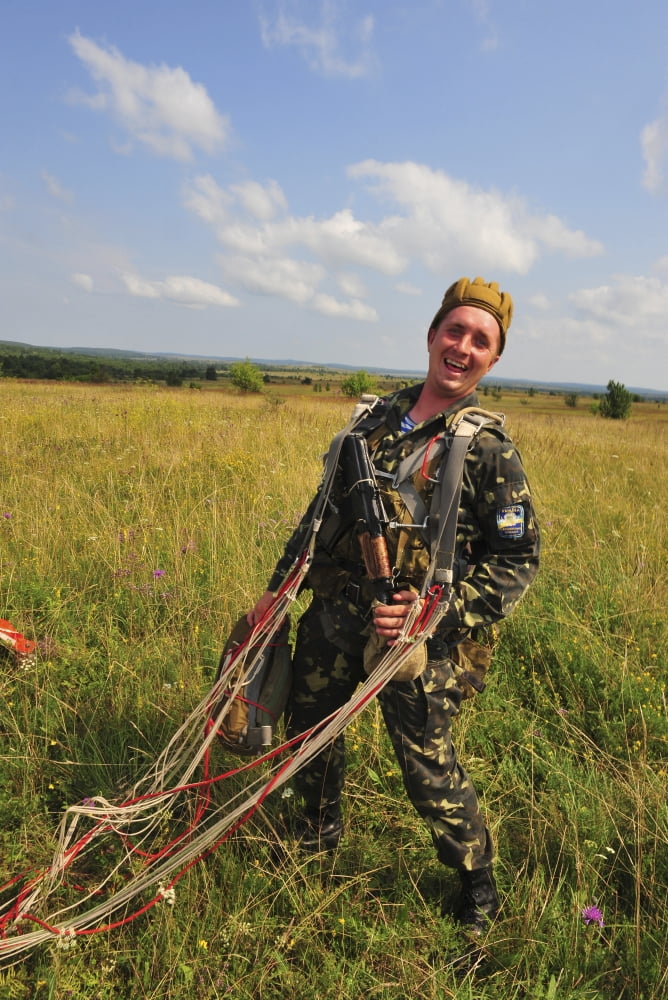 An Armed Forces of Ukraine paratrooper poses for a photo after landing Canvas Art - Stocktrek Images (23 x 34)