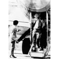 thumbnail image 1 of An Armed Hijacker Watches As Turkish Airlines Crew Member Employee Assists A Passenger Who Suffered A Heart, 1 of 1