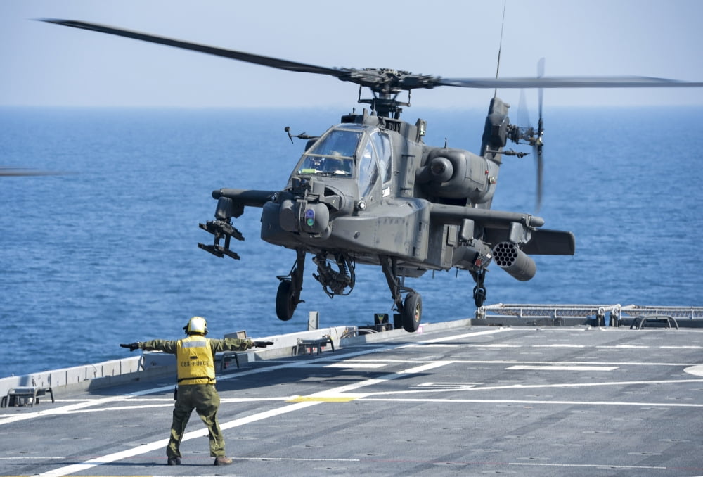 An Army AH-64D Apache helicopter prepares to land aboard USS Ponce Canvas Art - Stocktrek Images (35 x 24)