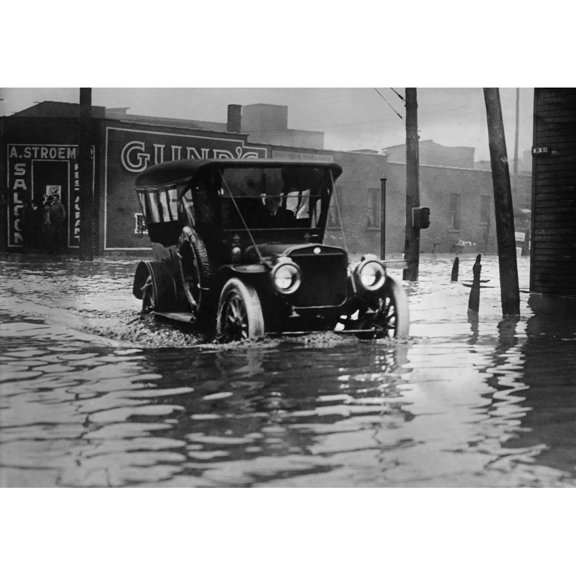 An Automobile Drives Through Axel High Water On A Flooded Cleveland Street History (24 x 18)