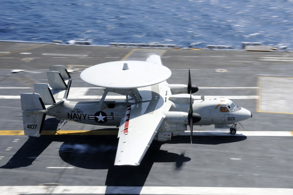 An E-2C Hawkeye lands aboard the aircraft carrier USS Nimitz Canvas Art - Stocktrek Images (35 x 23)
