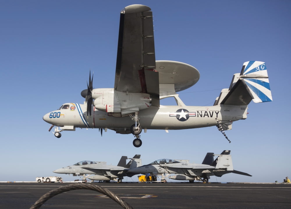 An E-2C Hawkeye makes an arrested landing aboard USS Dwight D Eisenhower Canvas Art - Gert KromhoutStocktrek Images (33 x 24)
