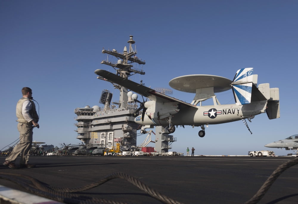 An E-2C Hawkeye makes an arrested landing aboard USS Dwight D Eisenhower Canvas Art - Gert KromhoutStocktrek Images (35 x 24)