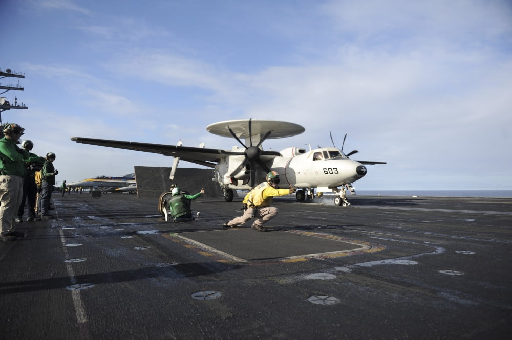 An E2-C Hawkeye prepares to launch from the flight deck of USS Nimitz Canvas Art - Stocktrek Images (34 x 23)
