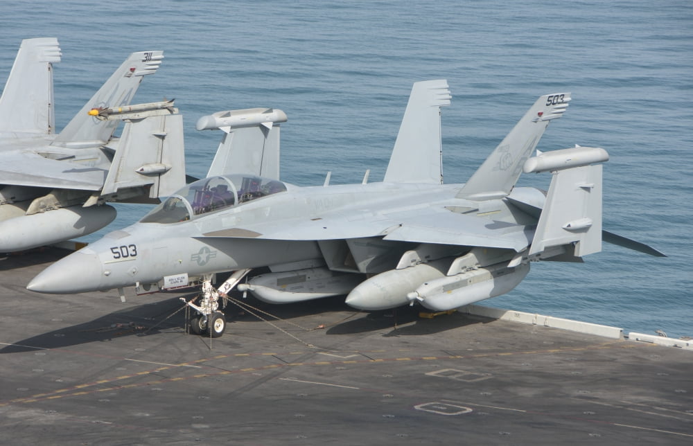 An EA-18G Growler aboard teh aircraft carrier USS Theodore Roosevelt Canvas Art - Giovanni CollaStocktrek Images (35 x 23)