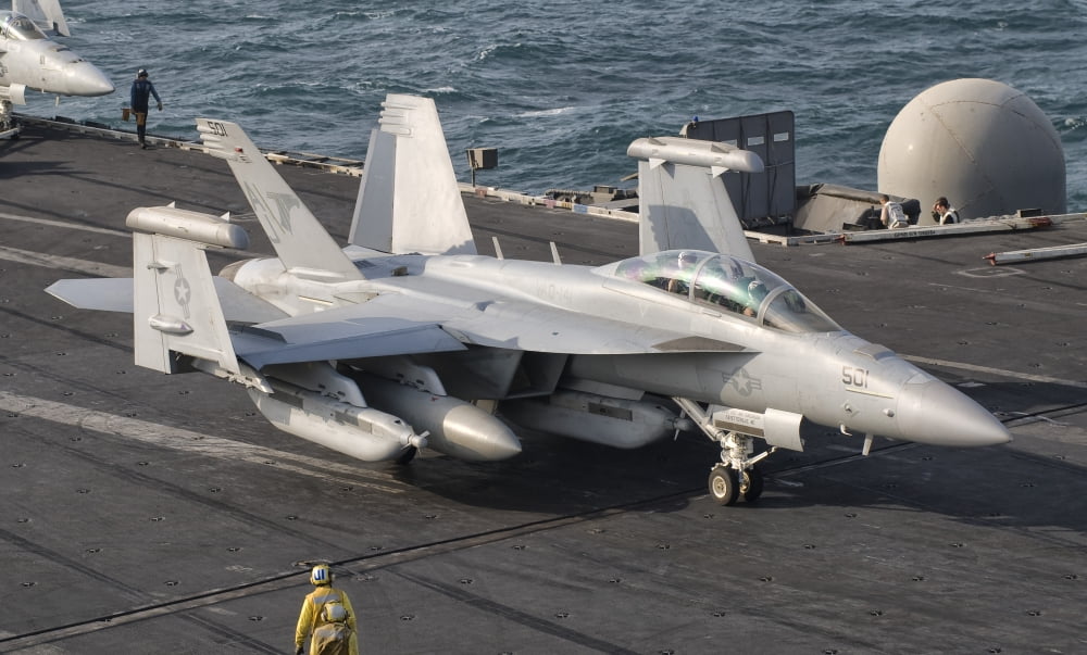 An EA-18G Growler is guided into catapult aboard USS George HW Bush Canvas Art - Giovanni CollaStocktrek Images (18 x 11)