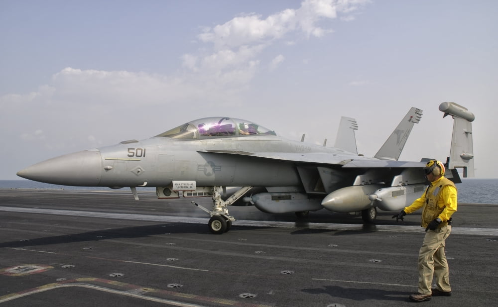 An EA-18G Growler is guided into catapult aboard USS George HW Bush Canvas Art - Giovanni CollaStocktrek Images (18 x 12)