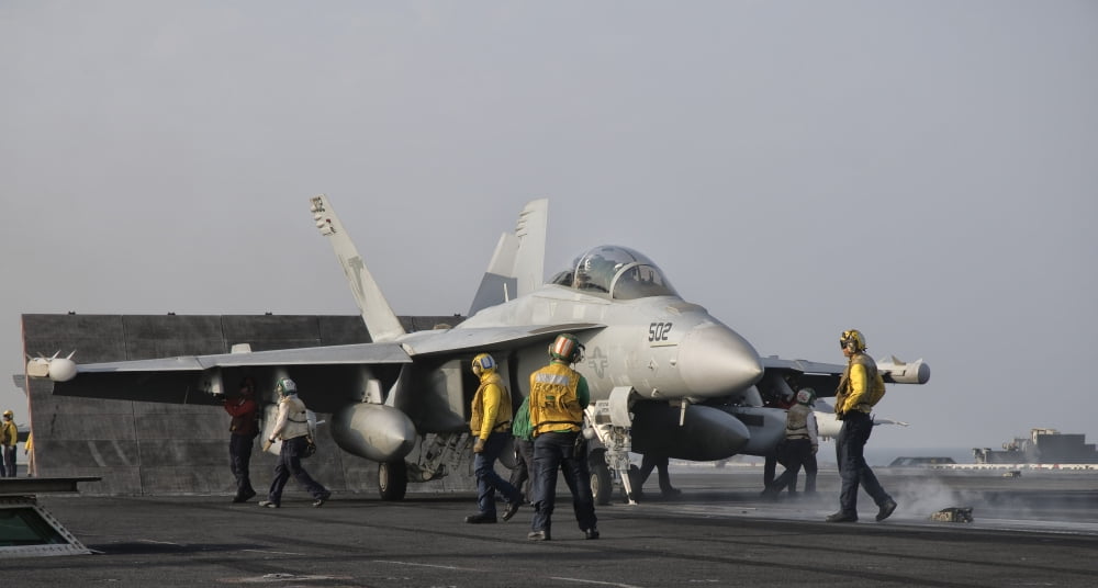 An EA-18G Growler is guided into catapult aboard USS George HW Bush Canvas Art - Giovanni CollaStocktrek Images (20 x 11)