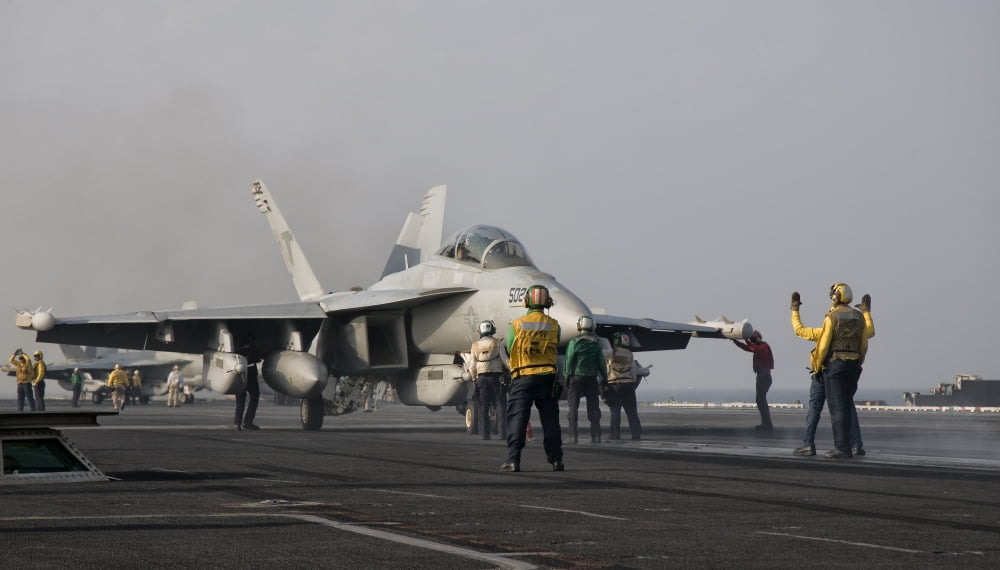 An EA-18G Growler is guided into catapult aboard USS George HW Bush Canvas Art - Giovanni CollaStocktrek Images (37 x 22)