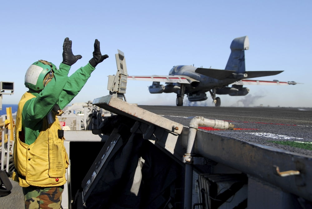 An EA-6B Prowler launches from the flight deck aboard USS Nimitz Canvas Art - Stocktrek Images (34 x 23)