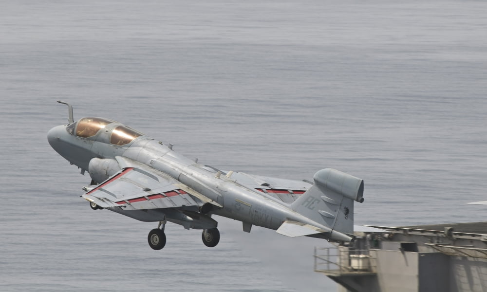 An EA-6B Prowler lifts off from the flight deck of USS Harry S Truman Canvas Art - Giovanni CollaStocktrek Images (19 x 11)