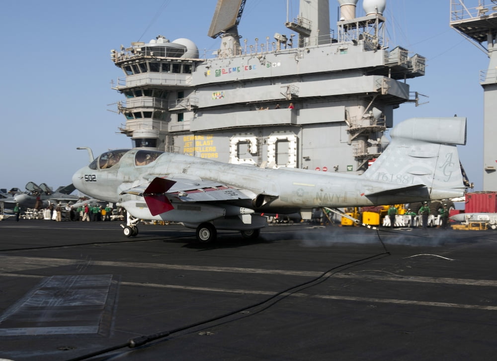 An EA-6B Prowler makes an arrested landing aboard USS Dwight D Eisenhower Canvas Art - Gert KromhoutStocktrek Images (33 x 24)