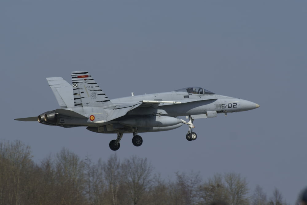 An EF-18 Hornet of the Spanish Air Force over Florennes Belgium Canvas Art - Ramon Van OpdorpStocktrek Images (35 x 23)