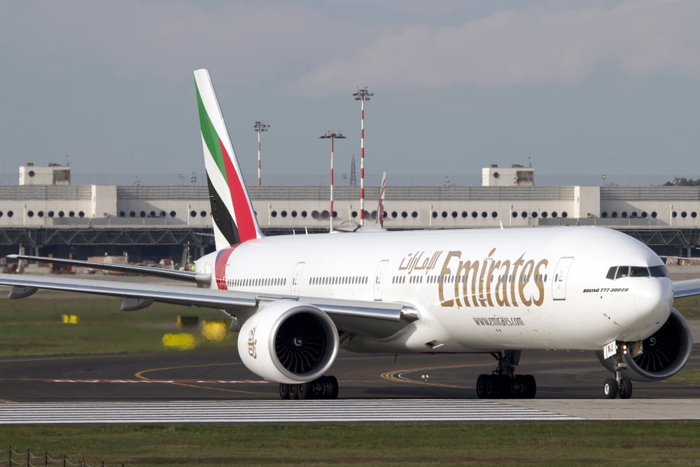 An Emirates Boeing 777 at Milano Malpensa Airport Italy Canvas Art - Luca NicolottiStocktrek Images (35 x 23)