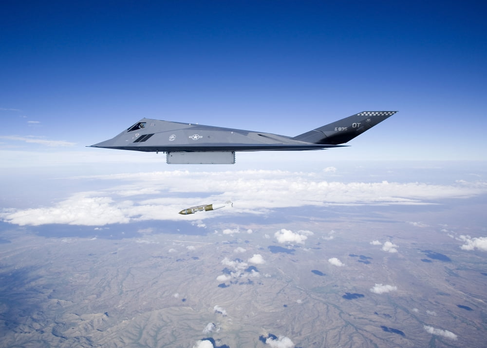 An F-117 Nighthawk releases a GBU-31 JDAM Canvas Art - HIGH-G ProductionsStocktrek Images (33 x 24)