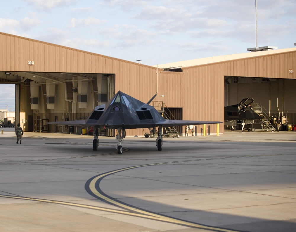 An F-117 Nighthawk taxis out of its hangar Canvas Art - HIGH-G ProductionsStocktrek Images (16 x 13)
