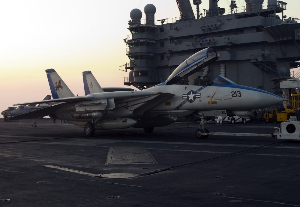 An F-14D Tomcat on the flight deck of USS Theodore Roosevelt Canvas Art - Gert KromhoutStocktrek Images (34 x 24)